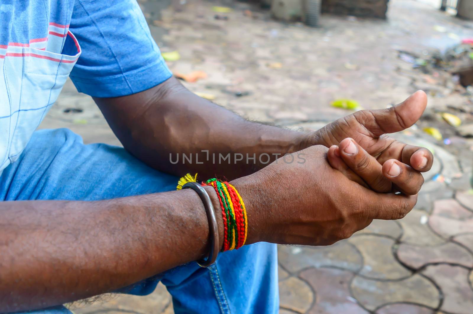 Close up of a mans hand preparing Chewing tobacco. by sudiptabhowmick