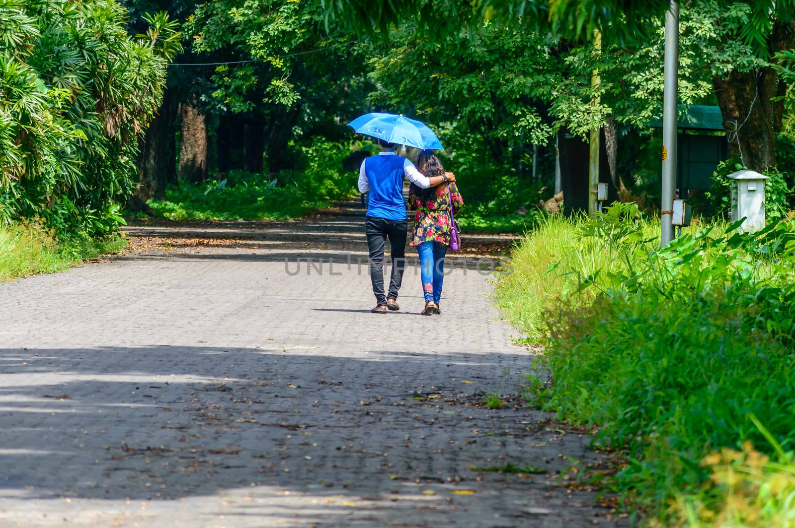 Cute couple walking in the park by sudiptabhowmick