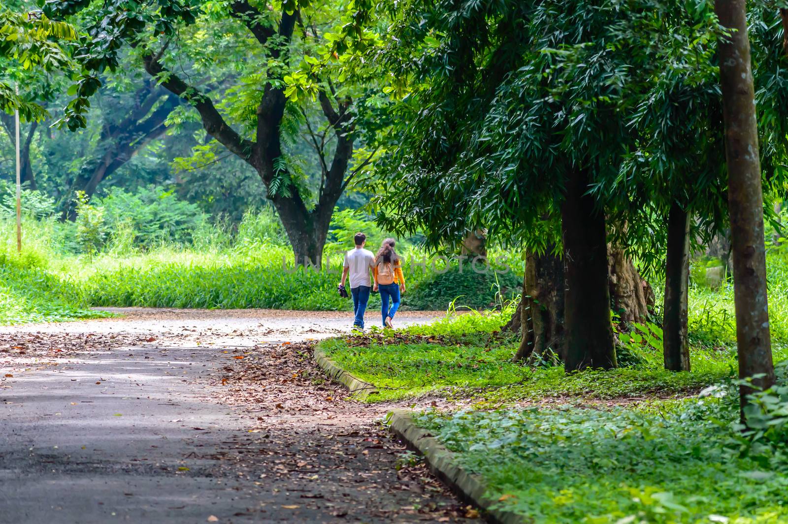 Happy married Cute couple walking in the park by sudiptabhowmick