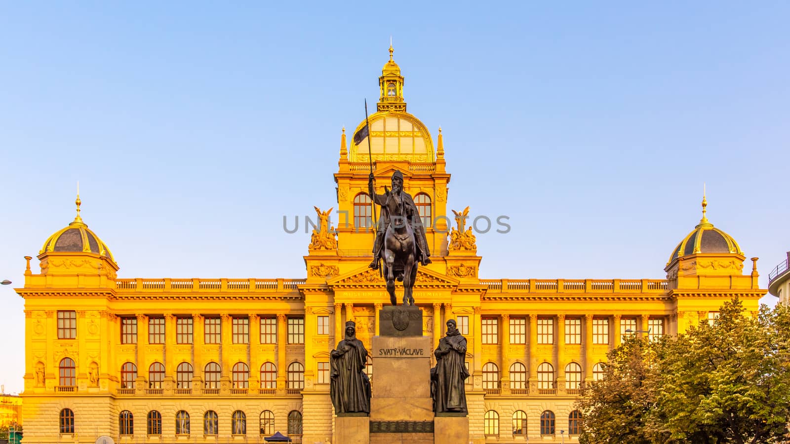 The bronze equestrian statue of St Wenceslas at the Wenceslas Square with historical Neorenaissance building of National Museum in Prague, Czech Republic by pyty
