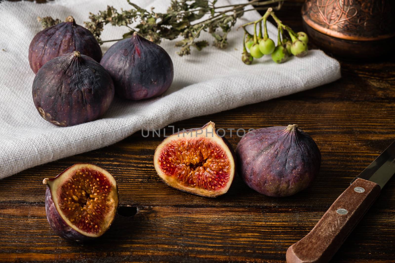 Ripe figs on cloth with sliced one and some objects by Seva_blsv