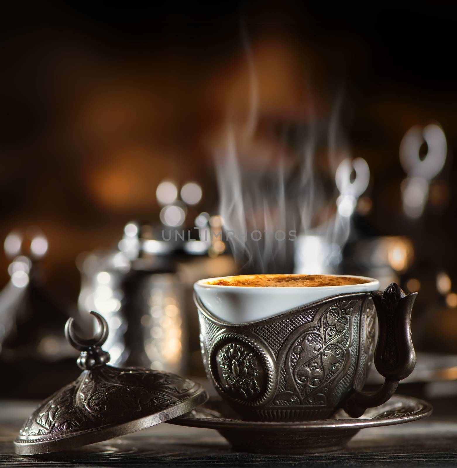 Metallic coffee set in turkish style on wooden table