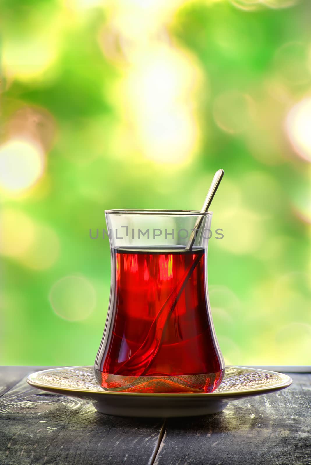 Glass of red turkish tea on a blurred background