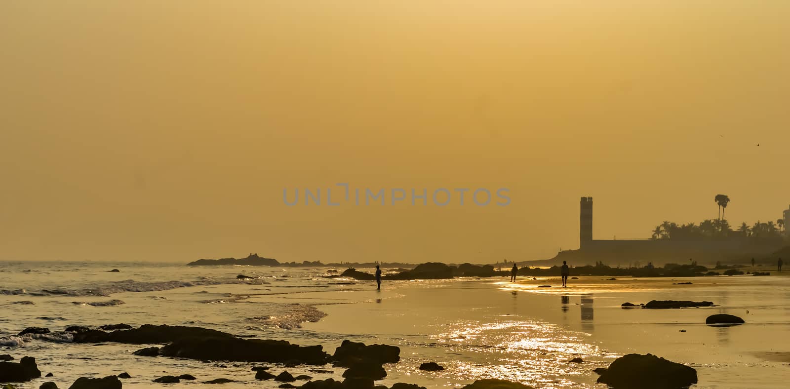 Beautiful sea shore at sunrise or sunset sunset Wild Empty Tropical beach, blue sky, sunlight reflextions on the shore at sunset time on a sunny day in in as landscape style may be used as a background, wallpaper, screen saver banner Travel vacation concept. The image is exciting, bright, sensational, tranquil, calm, stunning.