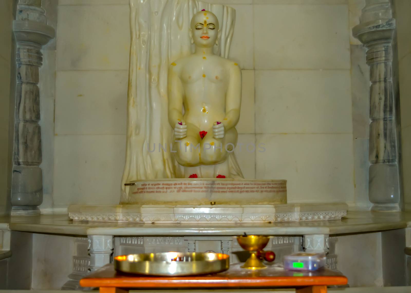 White marble sculpture of Jain god in meditation