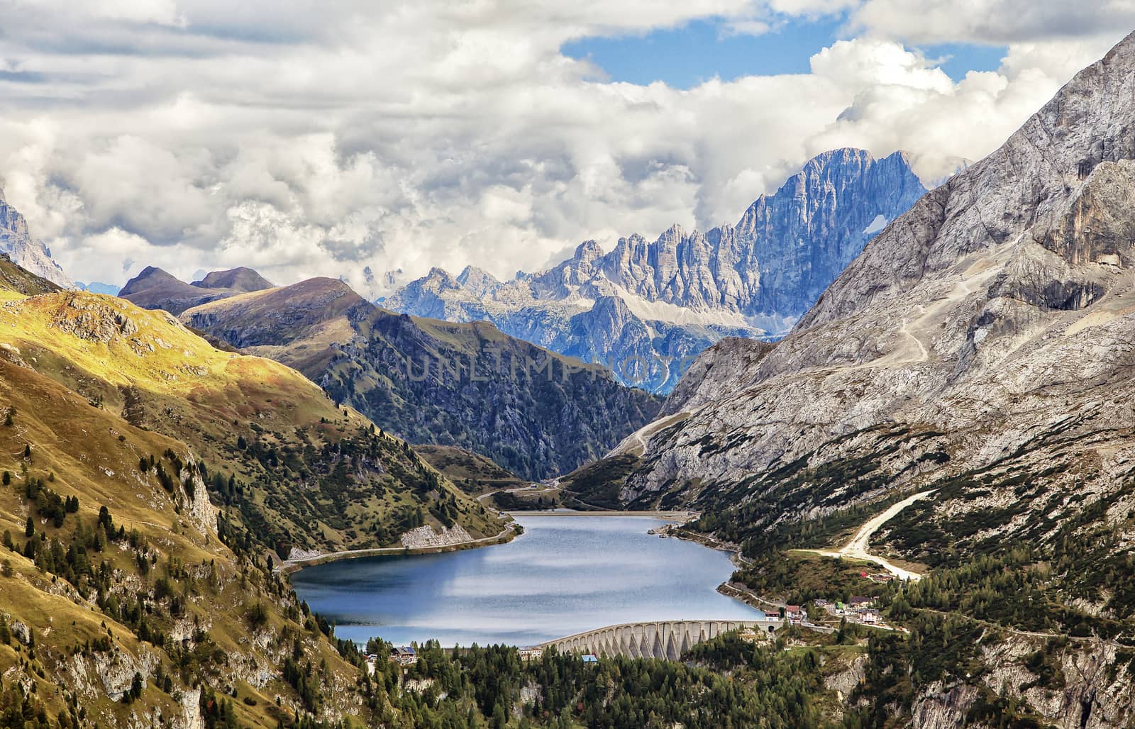 Fedaia lake in Dolomites with view of Marmolada mountain