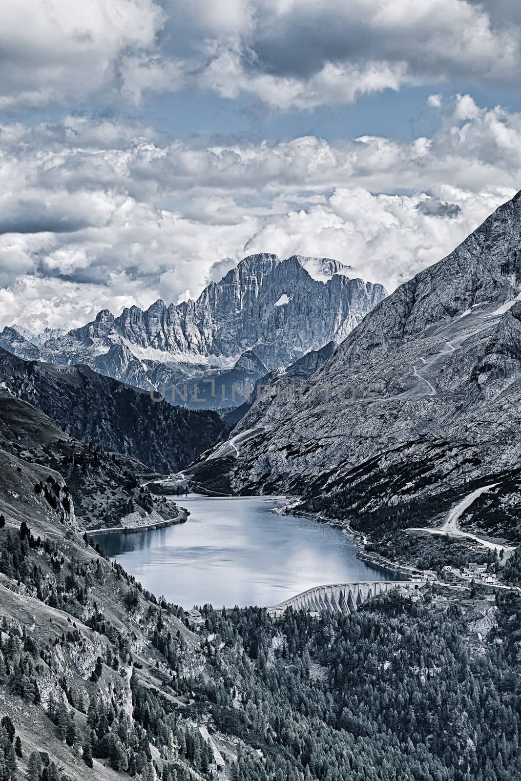 Fedaia lake in Dolomites with view of Marmolada mountain