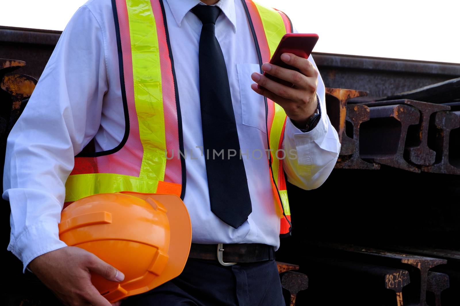 The engineer is working with smart phone with large industry bac by 0864713049