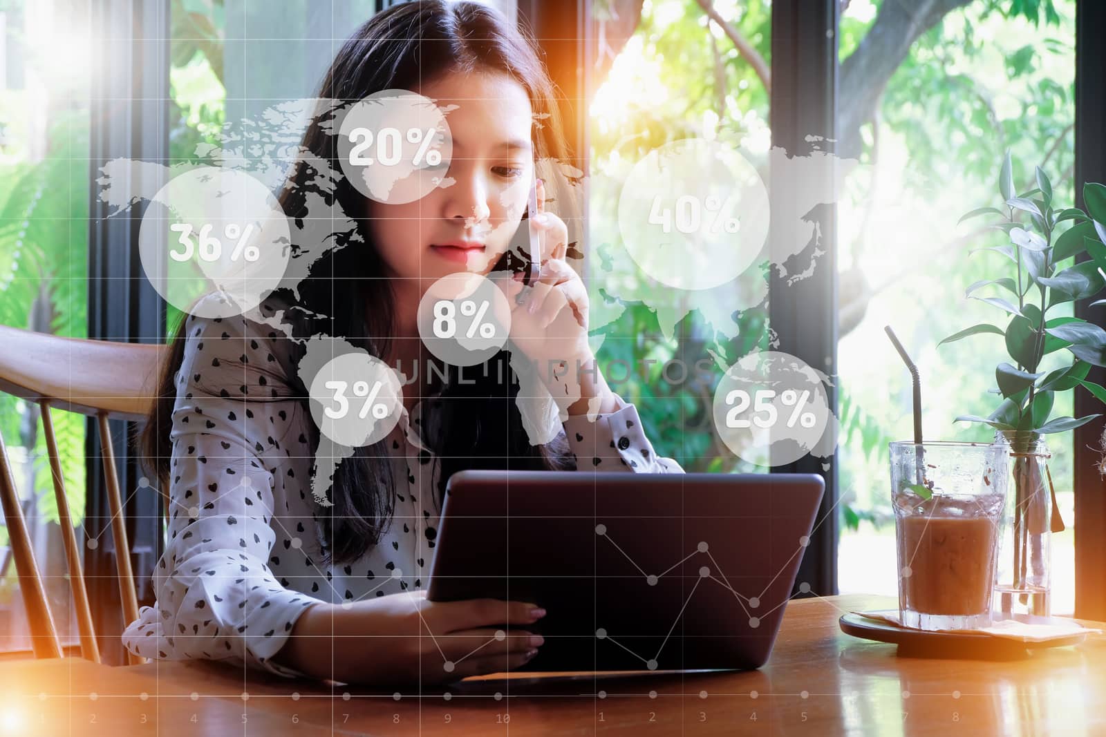 Young businesswoman is checking the sales of each region with her tablet.