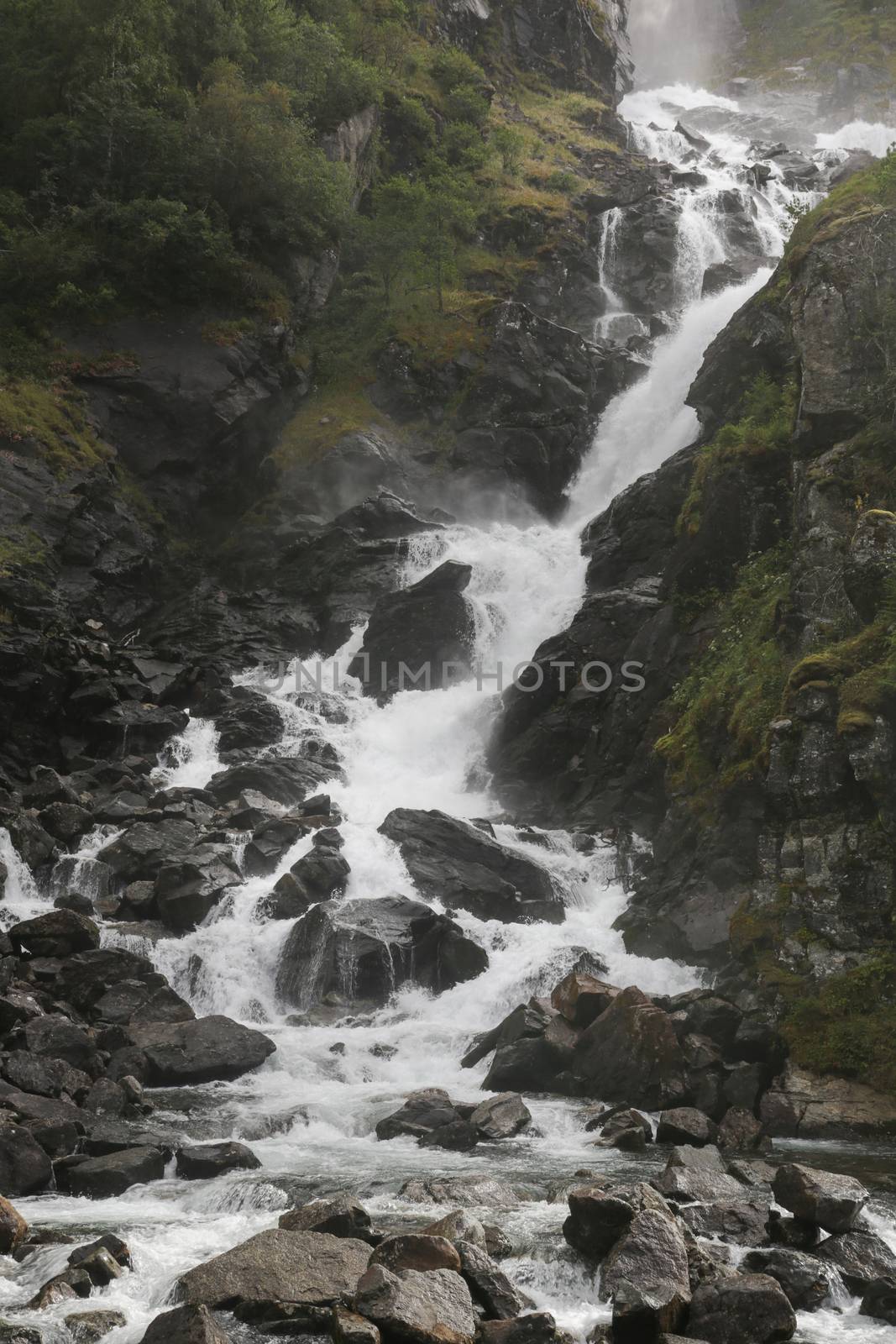 Soft water of the rough Latefossen falls in Odda Norway