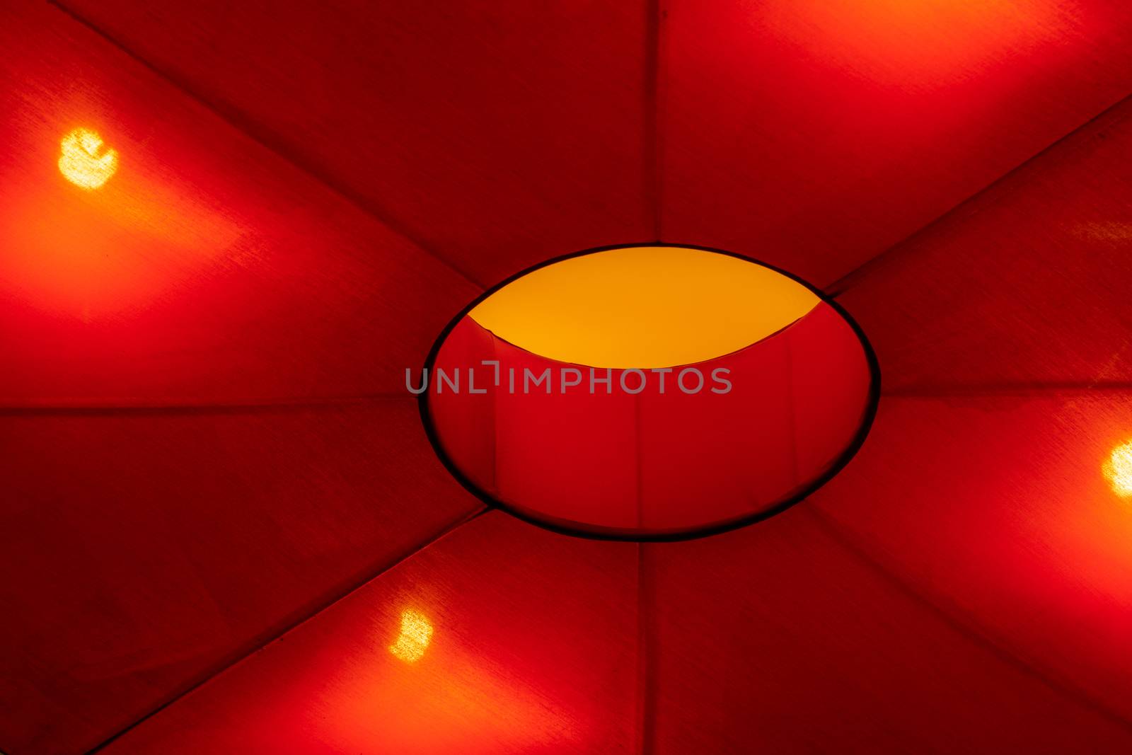 Interior ceiling red lights on dark background at night. Interior lighting concept. Red lights on ceiling.