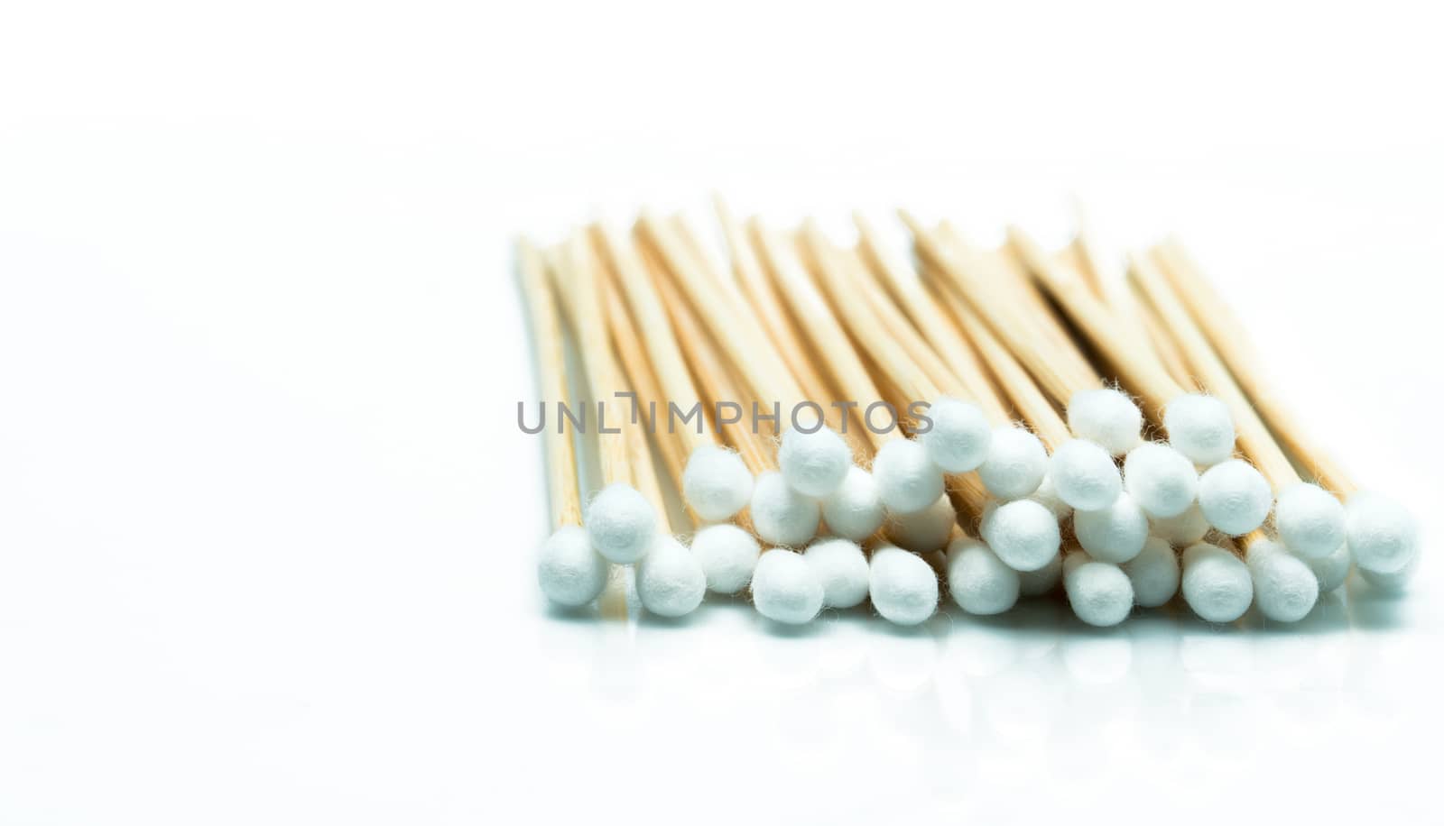 Cotton sticks isolated on white background with copy space for text. Wound care supply. Medical equipment. by Fahroni