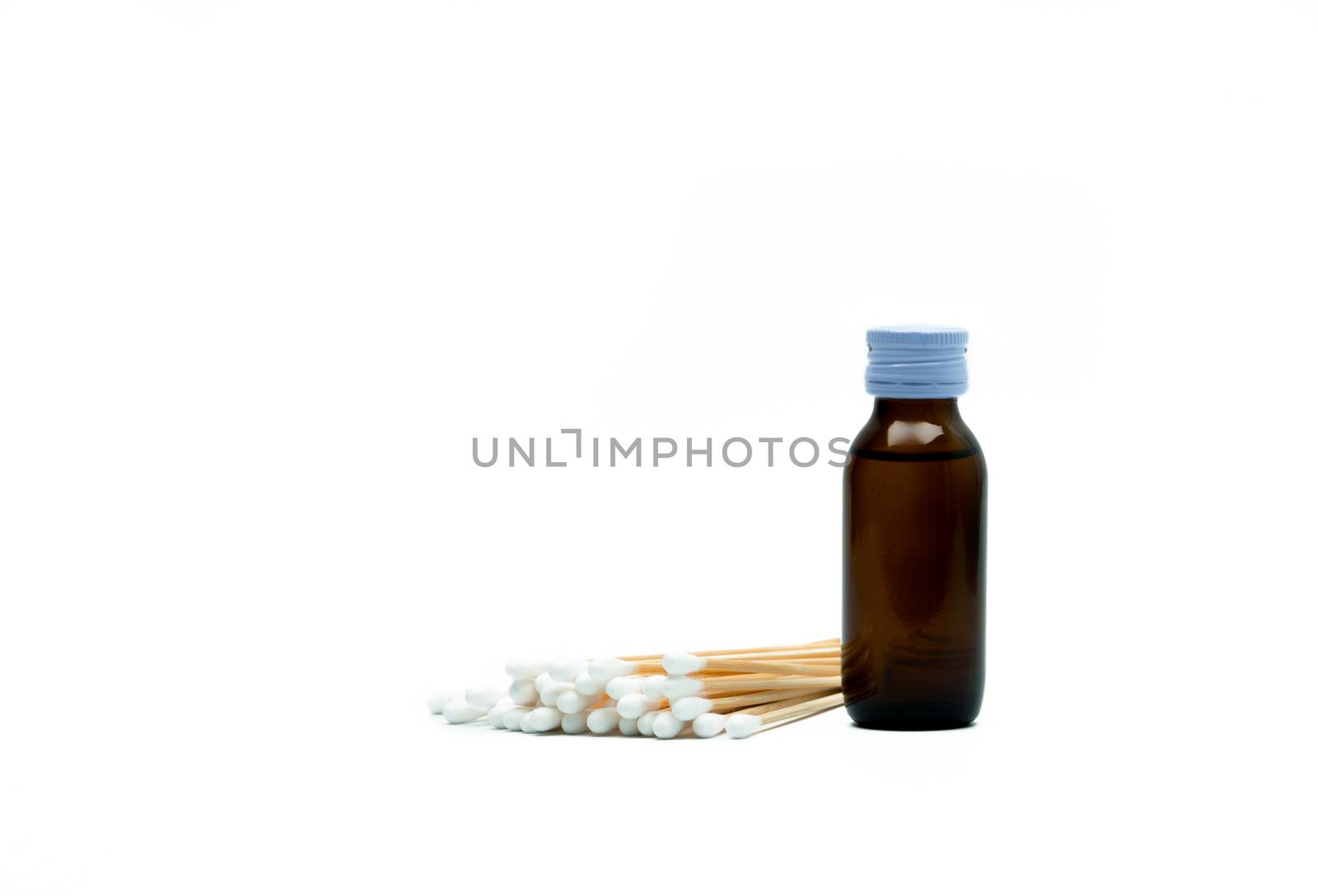 Cotton sticks and antiseptic solutions in amber glass bottle isolated on white background. Concept of Umbilical cord care for helps prevent infection. Infant's umbilical cord cleaning care equipment. by Fahroni