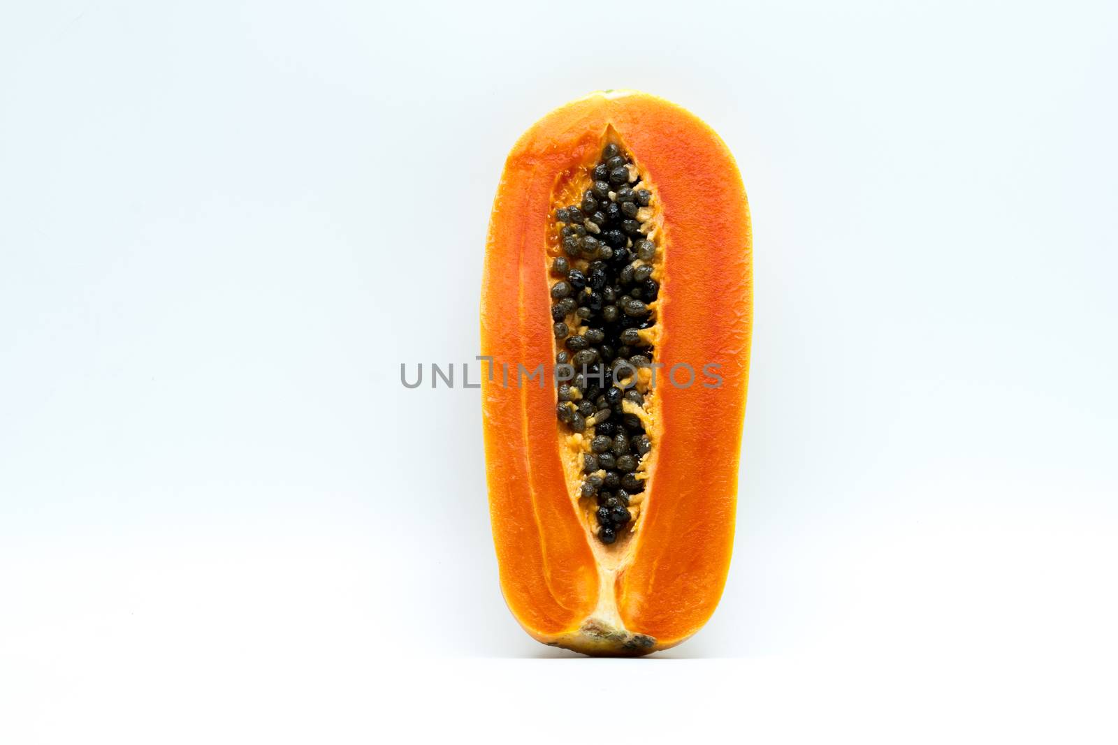 Half of ripe papaya fruit with seeds isolated on white background with copy space. Natural source of vitamin C, folate and minerals. Healthy food for pregnant and breast feeding woman