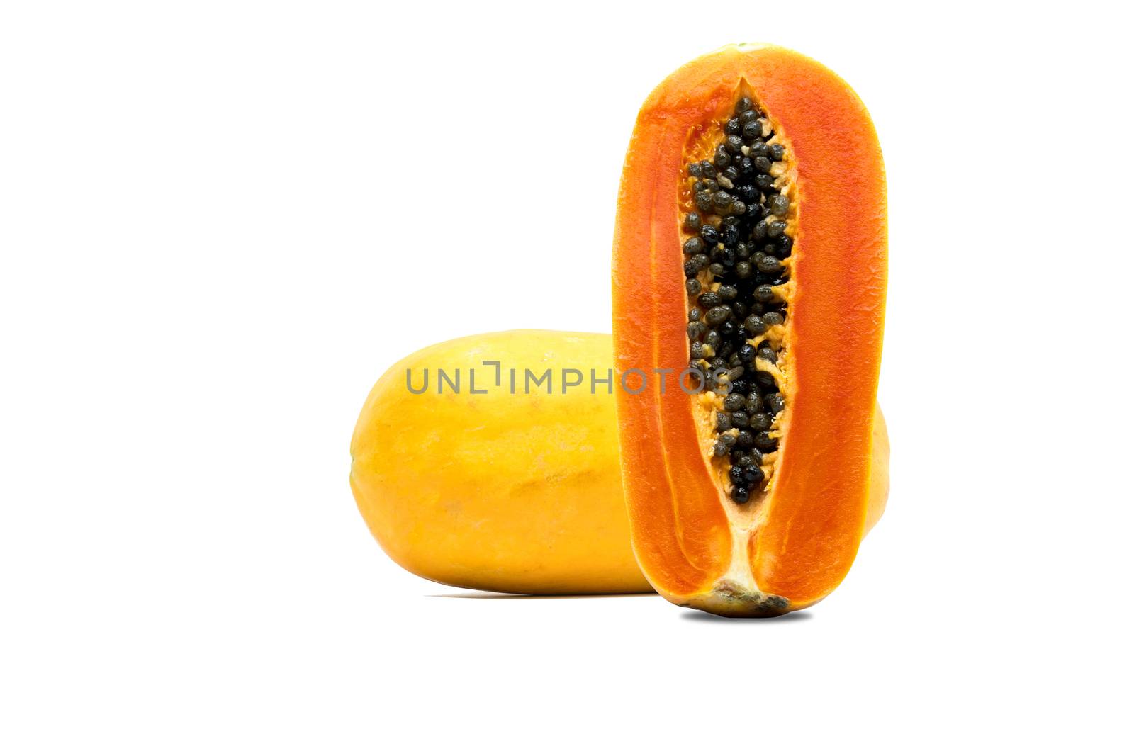 Whole and half of ripe papaya fruit with seeds isolated on white background with copy space. Natural source of vitamin C, folate and minerals. Healthy food for pregnant and breast feeding woman by Fahroni