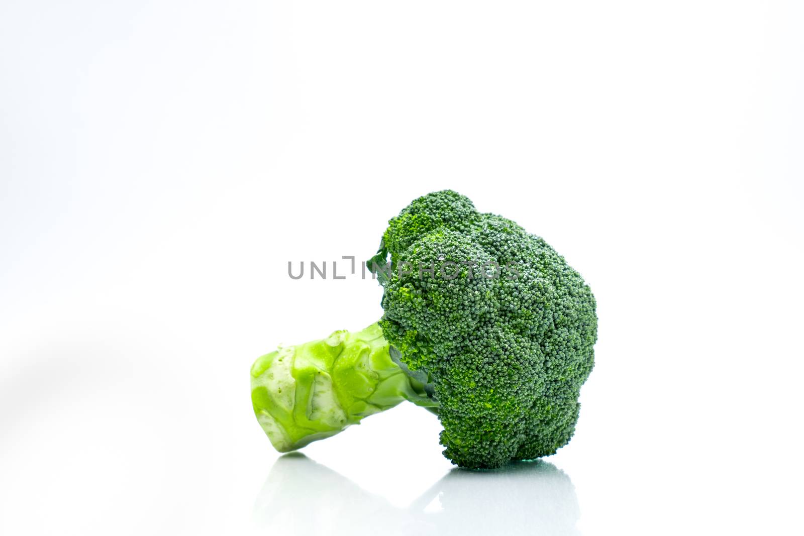 Green broccoli (Brassica oleracea). Vegetables natural source of betacarotene, vitamin c, vitamin k, fiber food, folate. Fresh broccoli cabbage isolated on white background with copy space. by Fahroni