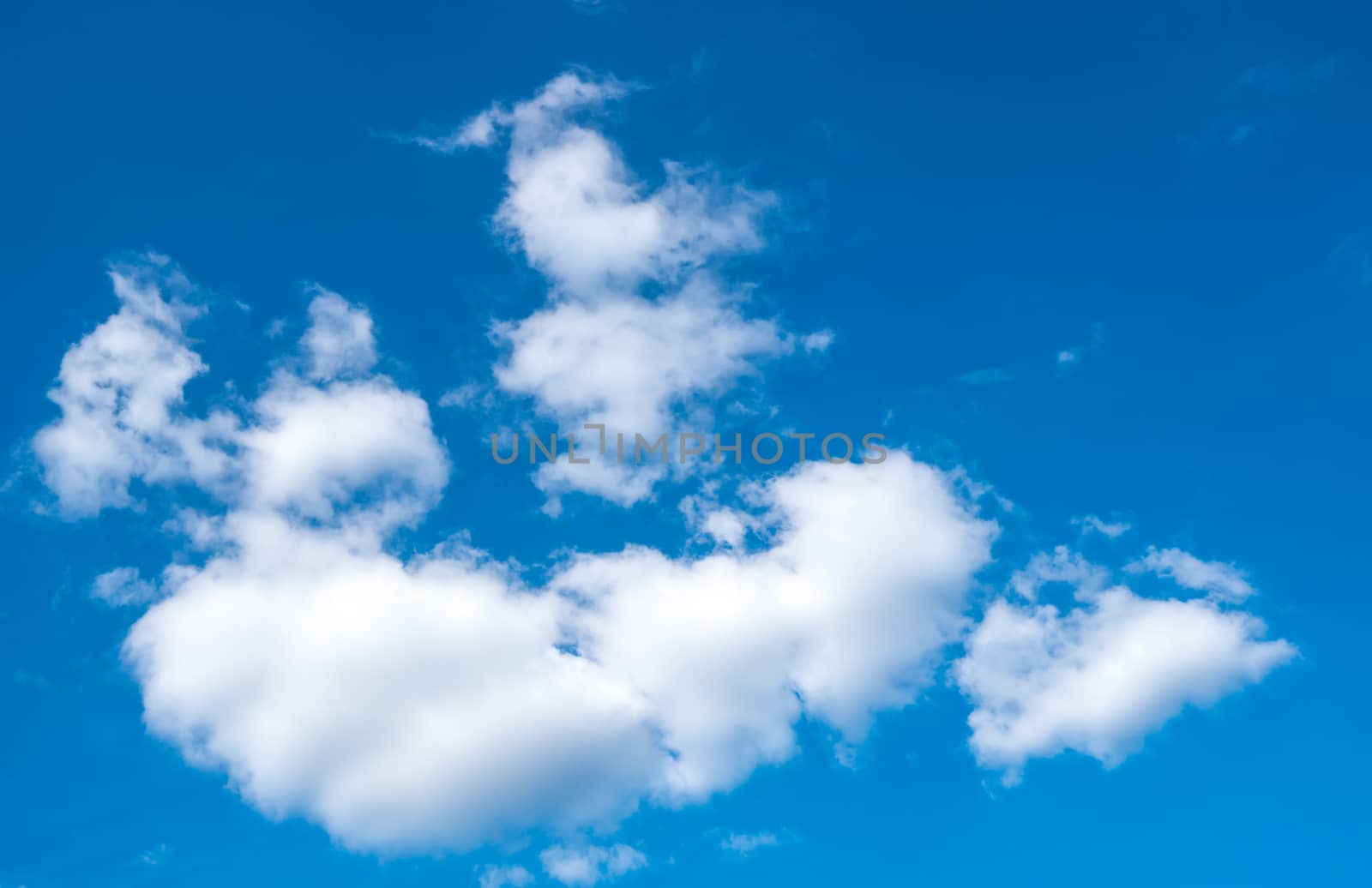 Beautiful white cumulus clouds and blue sky with space by Fahroni