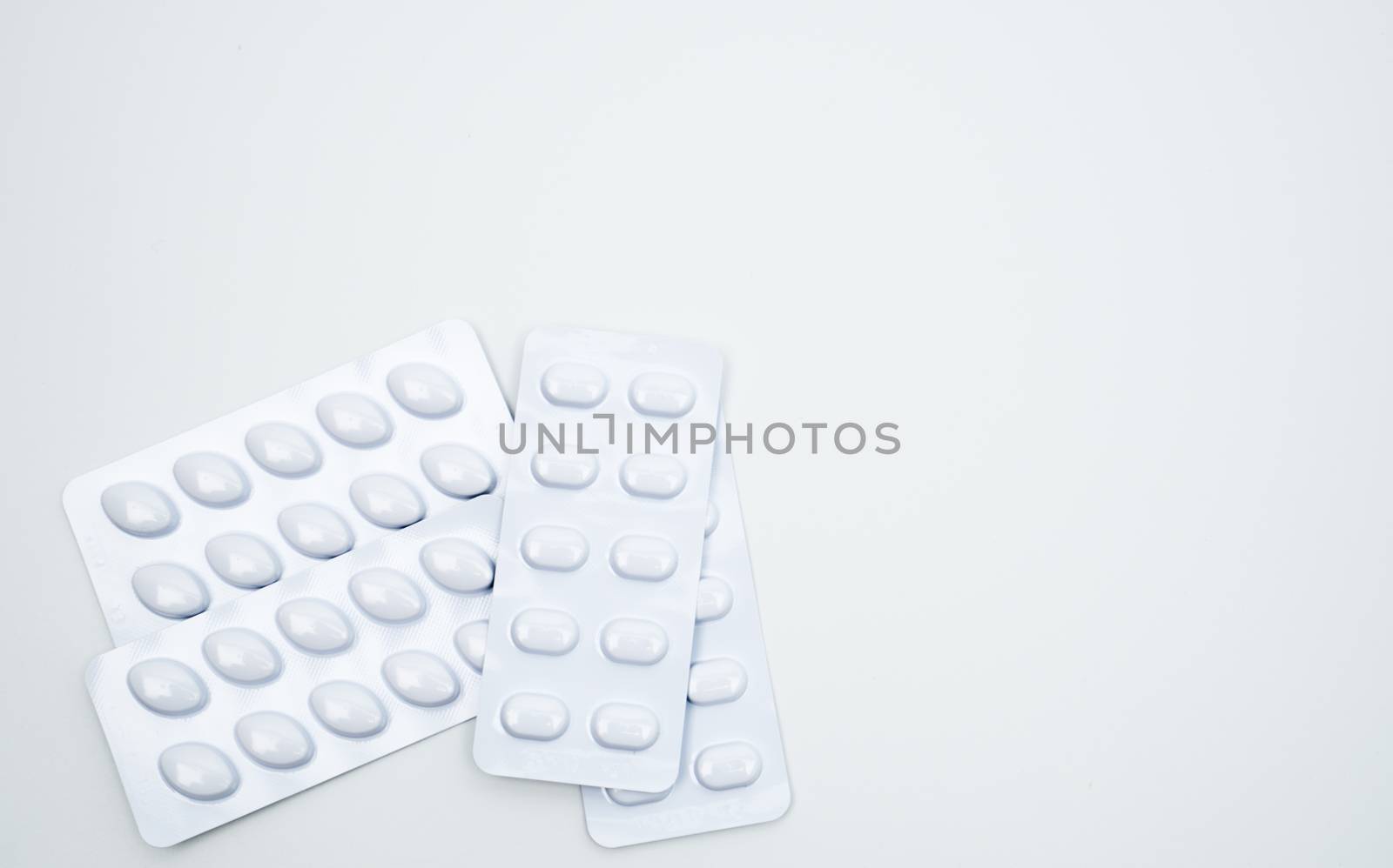 Statins tablets pill in white blister pack for light resistance packaging isolated on white background. Medicine for treatment dyslipidemia. Lipid lowering tablets pills. Statins : Hyperlipidemia. Pharmaceutical insudtry. Pharmacy background. Global healthcare concept.