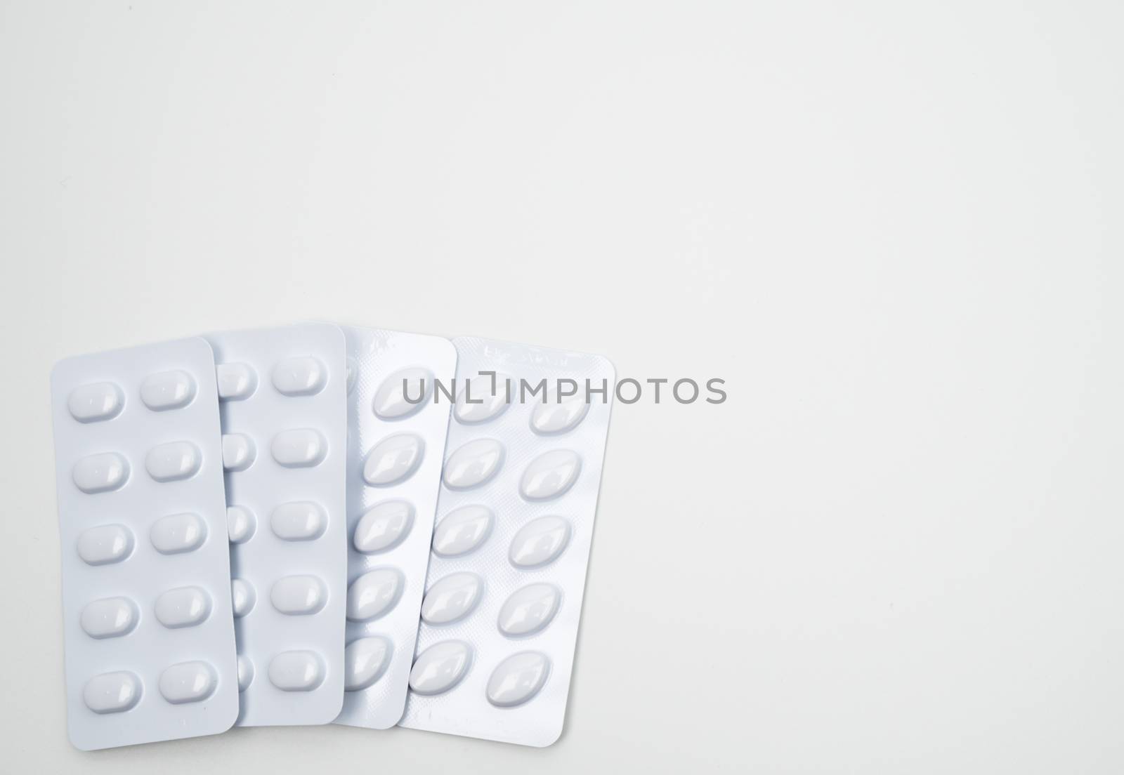 Statins tablets pill in white blister pack for light resistance packaging isolated on white background. Medicine for treatment dyslipidemia. Lipid lowering tablets pills. Statins : Hyperlipidemia. Pharmaceutical insudtry. Pharmacy background. Global healthcare concept.