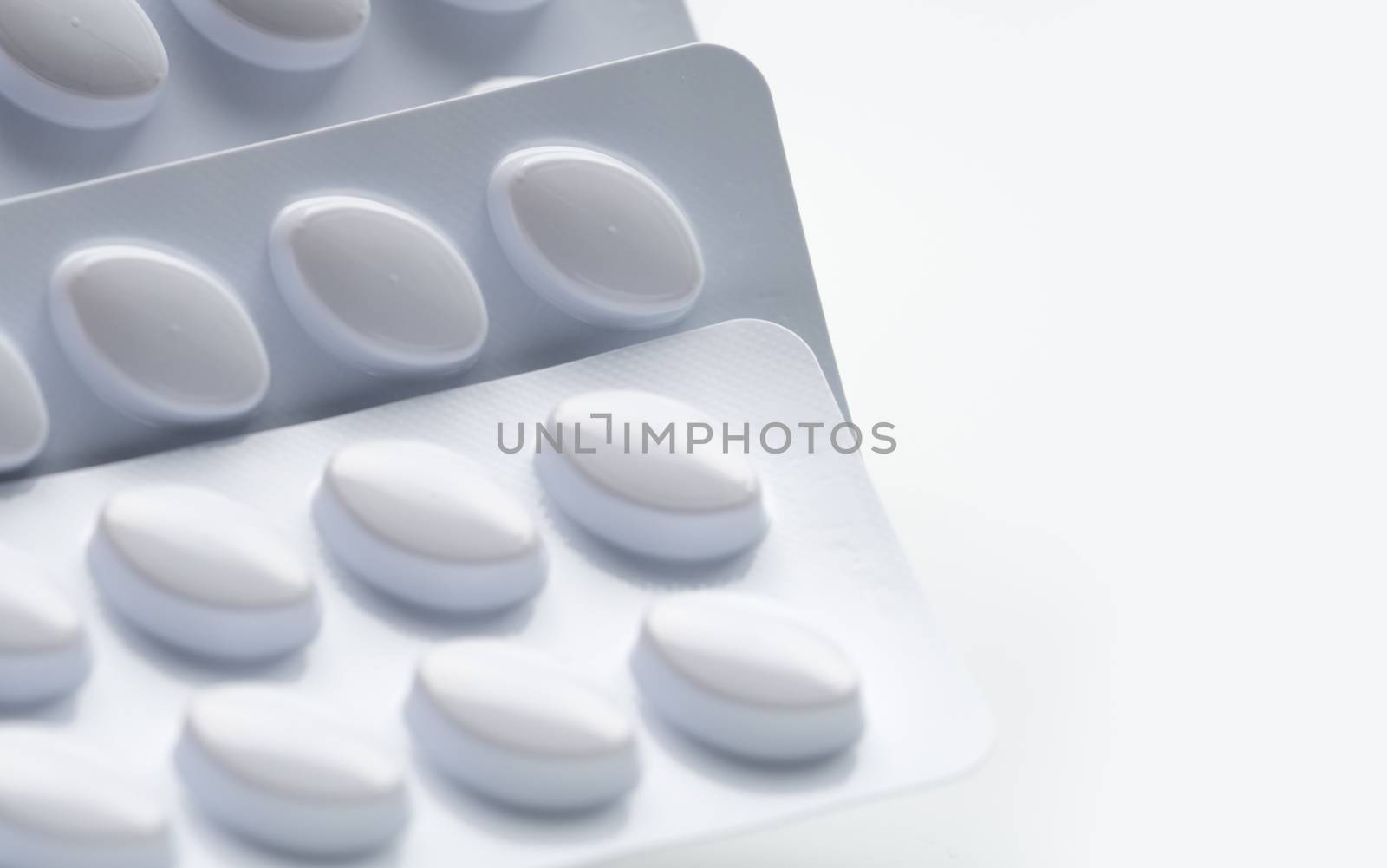 Statins tablets pill in white blister pack for light resistance packaging isolated on white background. Medicine for treatment dyslipidemia. Lipid lowering tablets pills. Statins : Hyperlipidemia. Pharmaceutical industry. Pharmacy background. Global healthcare concept. Health budgets and policy.