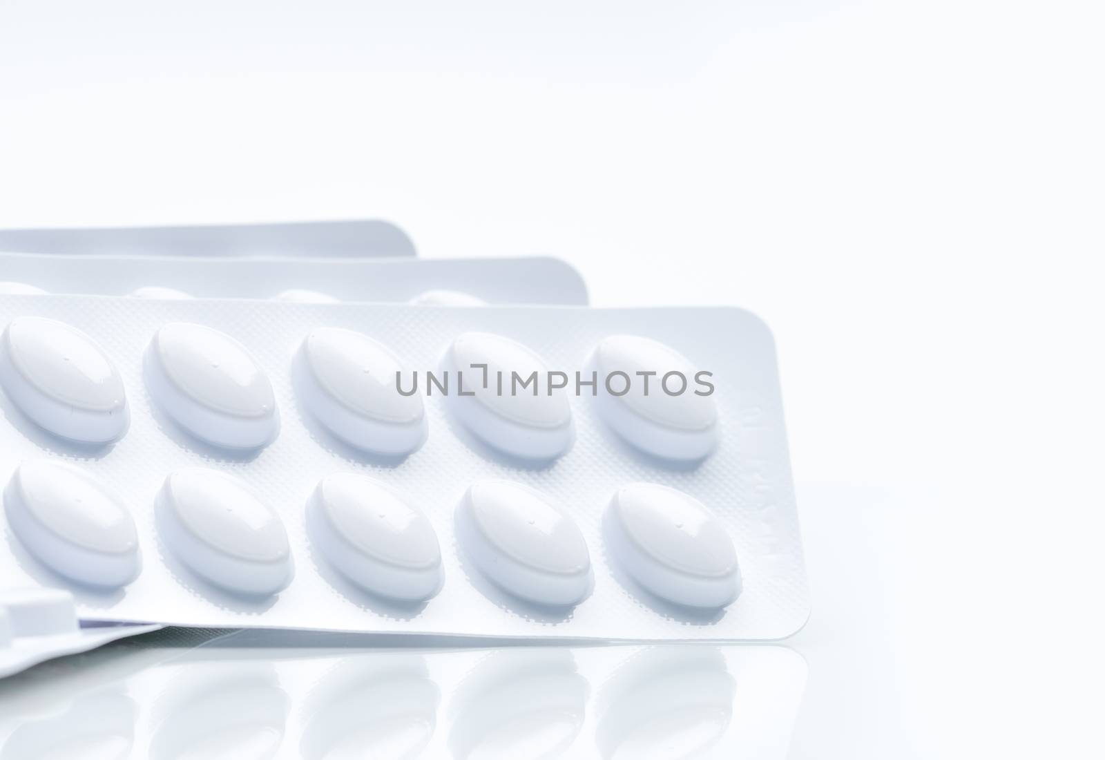 Statins tablets pill in white blister pack for light resistance packaging isolated on white background. Medicine for treatment dyslipidemia. Lipid lowering tablets pills. Statins : Hyperlipidemia. Pharmaceutical industry. Pharmacy background. Global healthcare concept. Health budgets and policy.
