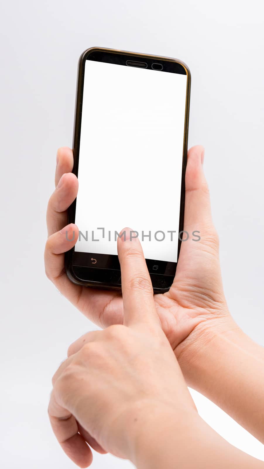 Close-up hand touching smartphone screen isolated on white background with clipping path and copy space for text, mock up mobile phone with blank screen. by Fahroni