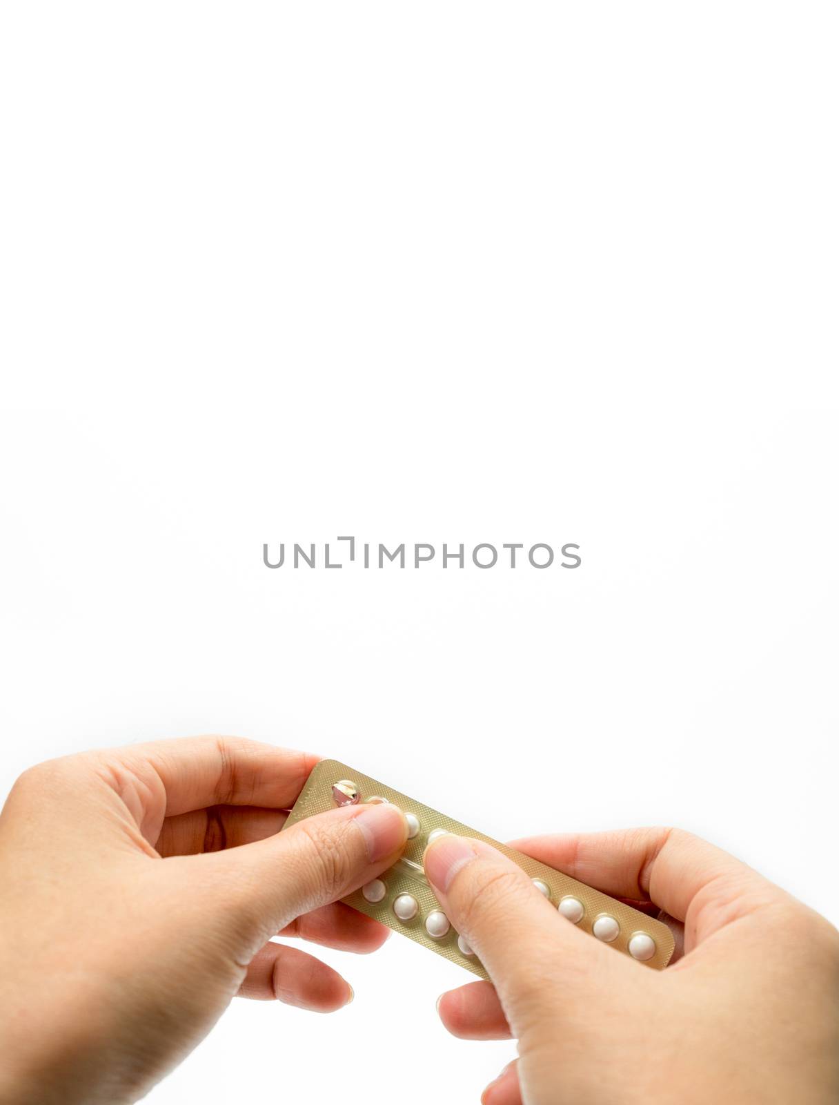 Woman hand taking birth control pills. Asian adult woman holding pack of contraceptive pills isolated on white background with clipping path. Choosing family planning with birth control pill concept