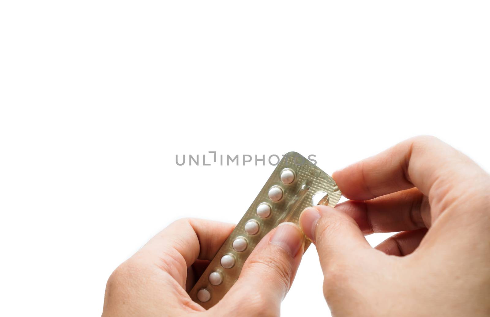 Woman hand taking birth control pills. Asian adult woman holding pack of contraceptive pills isolated on white background with clipping path. Choosing family planning with birth control pill concept by Fahroni
