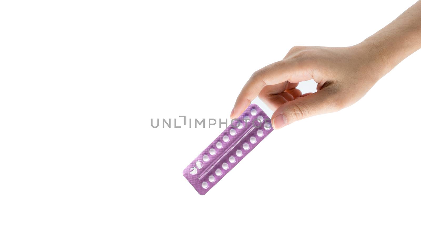 Woman hand taking birth control pills. Asian adult woman holding pack of contraceptive pills isolated on white background with clipping path. Choosing family planning with birth control pills concept by Fahroni