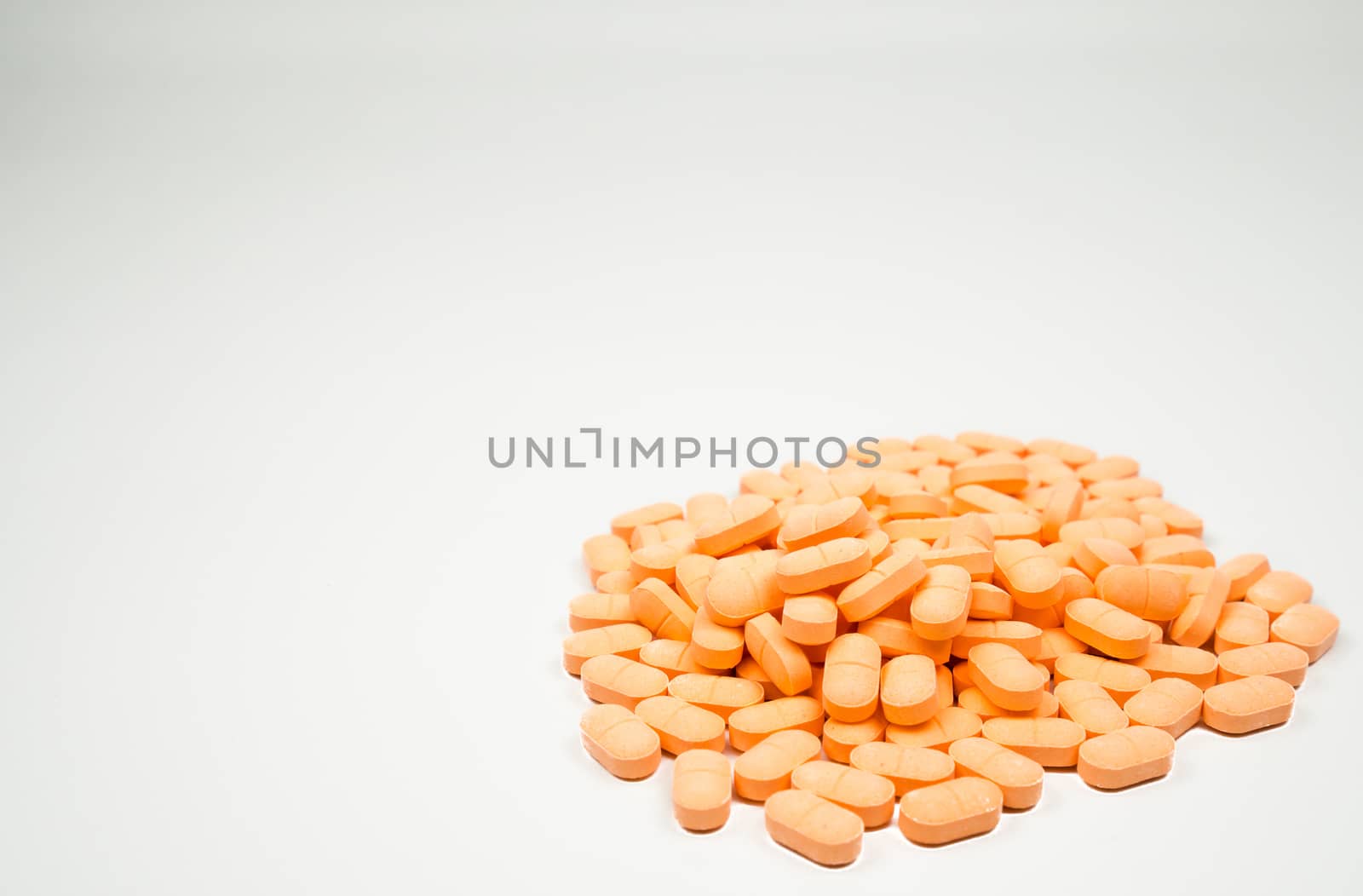 Pile of muscle relaxant, pain relief tablet pills isolated on white background with copy space for text. Pharmaceutical industry. Pharmacy background. Global healthcare concept.