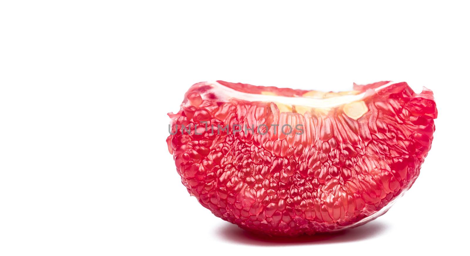Red pomelo pulp with seeds isolated on white background with clipping path. Thailand Siam ruby pomelo fruit. Natural source of vitamin C (antioxidants) and potassium. Healthy food for slow down aging
