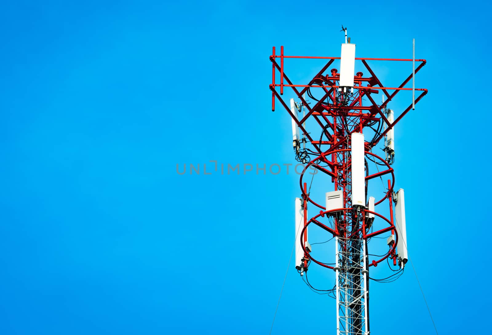 Telecommunication tower with clear blue sky background