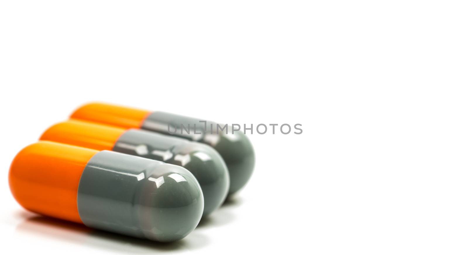 Selective focus of antibiotic capsules pills on blur background with copy space. Drug resistance concept. Antibiotics drug use with reasonable and global healthcare concept. Pharmaceutical industry. Pharmacy background.