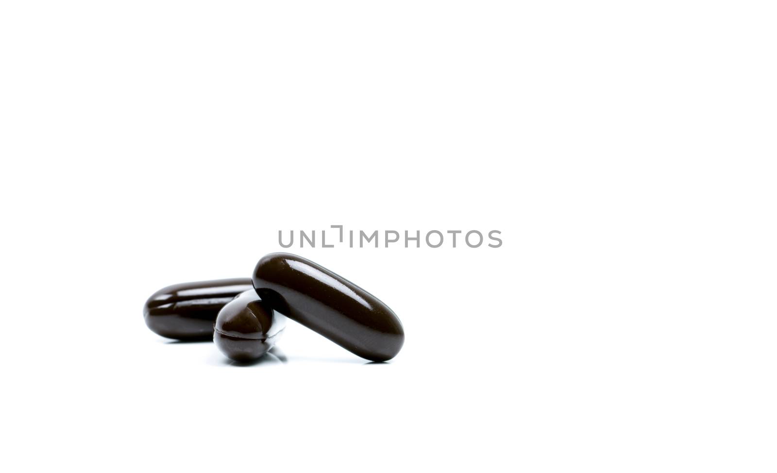Multivitamins capsule pills for pregnant woman with copy space for text isolated on white background. Vitamins and supplements for hard working guy. Global healthcare concept. Pharmaceutical industry. Pharmacy background. Health budgets and policy.