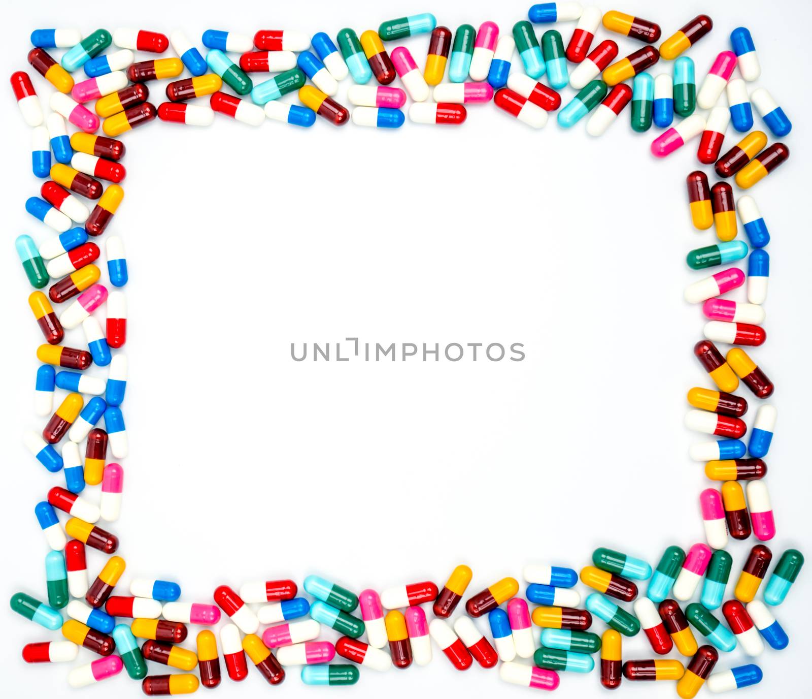 Colorful of antibiotics capsule pills on white background with copy space. Drug resistance concept. Antibiotics drug use with reasonable and global healthcare concept. Background for text by Fahroni
