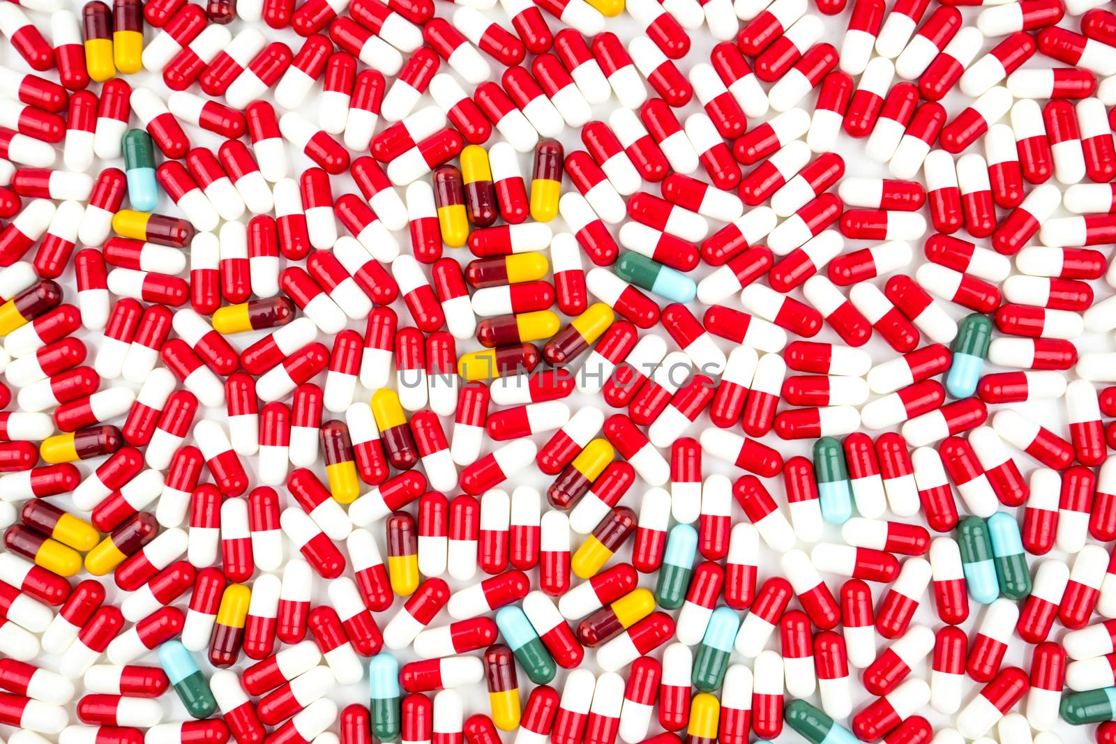 Colorful of antibiotic capsules pills isolated on white background with copy space. Drug resistance concept. Antibiotics drug use with reasonable and global healthcare concept. Pharmaceutical industry. Pharmacy background. by Fahroni