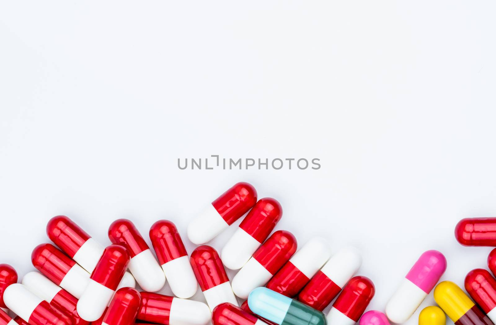 Colorful of antibiotic capsules pills isolated on white background with copy space. Drug resistance concept. Antibiotics drug use with reasonable and global healthcare concept. Pharmaceutical industry. Pharmacy background. by Fahroni
