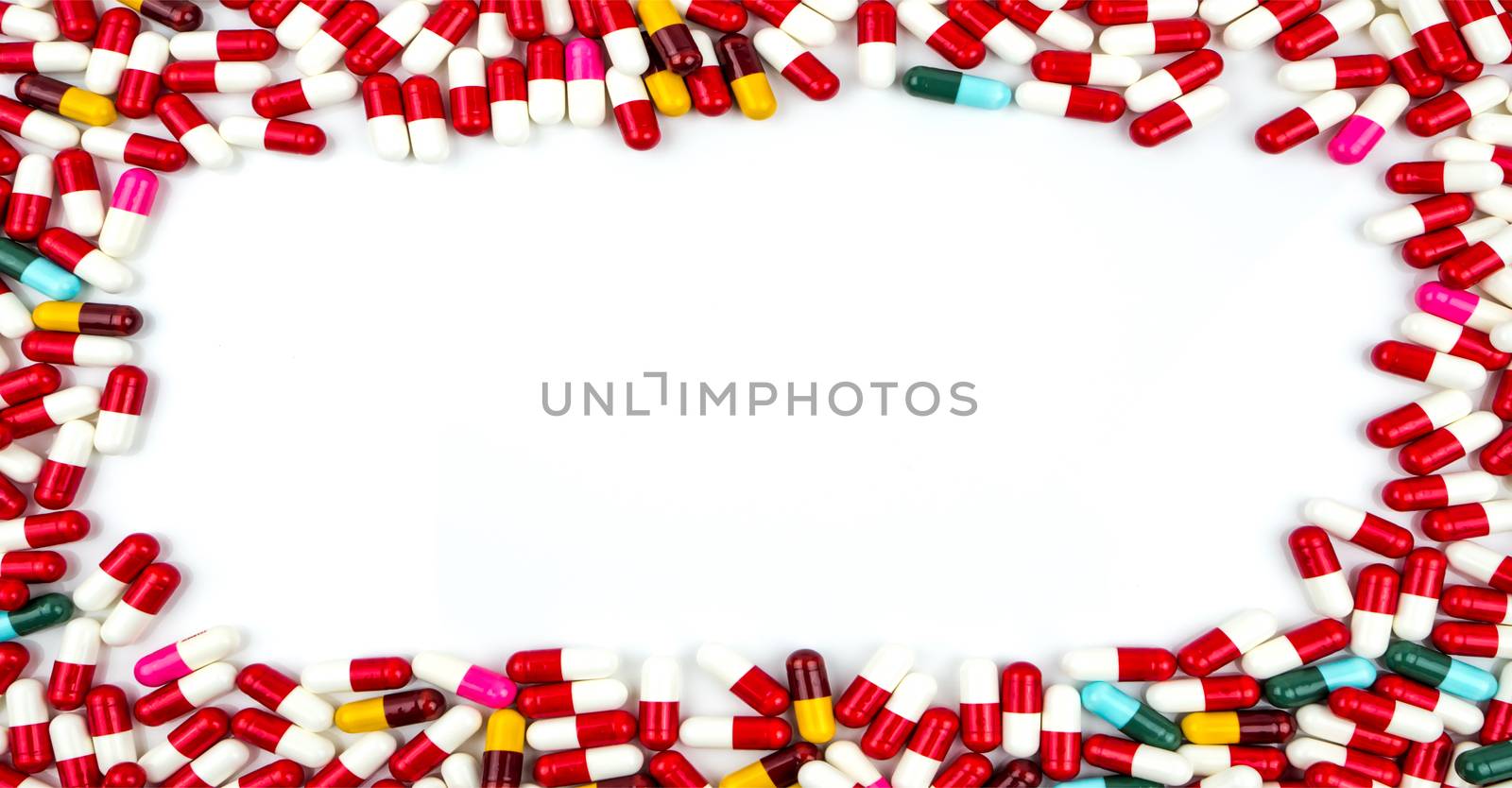 Colorful of antibiotics capsule pills rectangle frame on white background with copy space. Drug resistance concept. Antibiotics drug use with reasonable and global healthcare concept. Pharmacy background.
