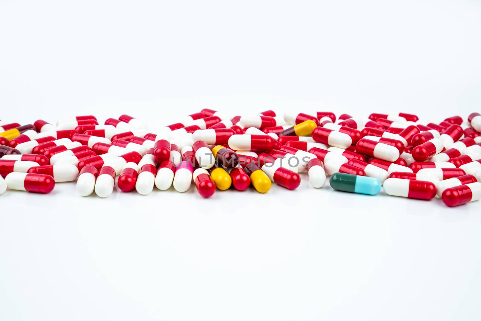 Selective focus of antibiotic capsules pills on white background. Drug resistance concept. Antibiotics drug use with reasonable and global healthcare concept. Pharmaceutical industry. Pharmacy background.