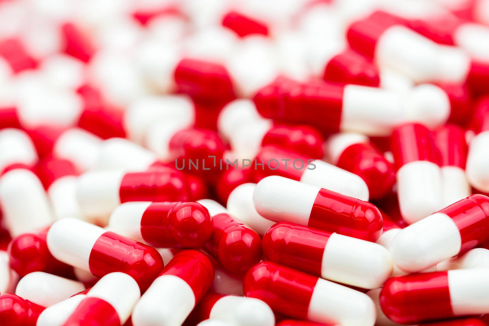 Selective focus of antibiotic capsules pills on blur background with copy space. Drug resistance concept. Antibiotics drug use with reasonable and global healthcare concept. Pharmaceutical industry. Pharmacy background.