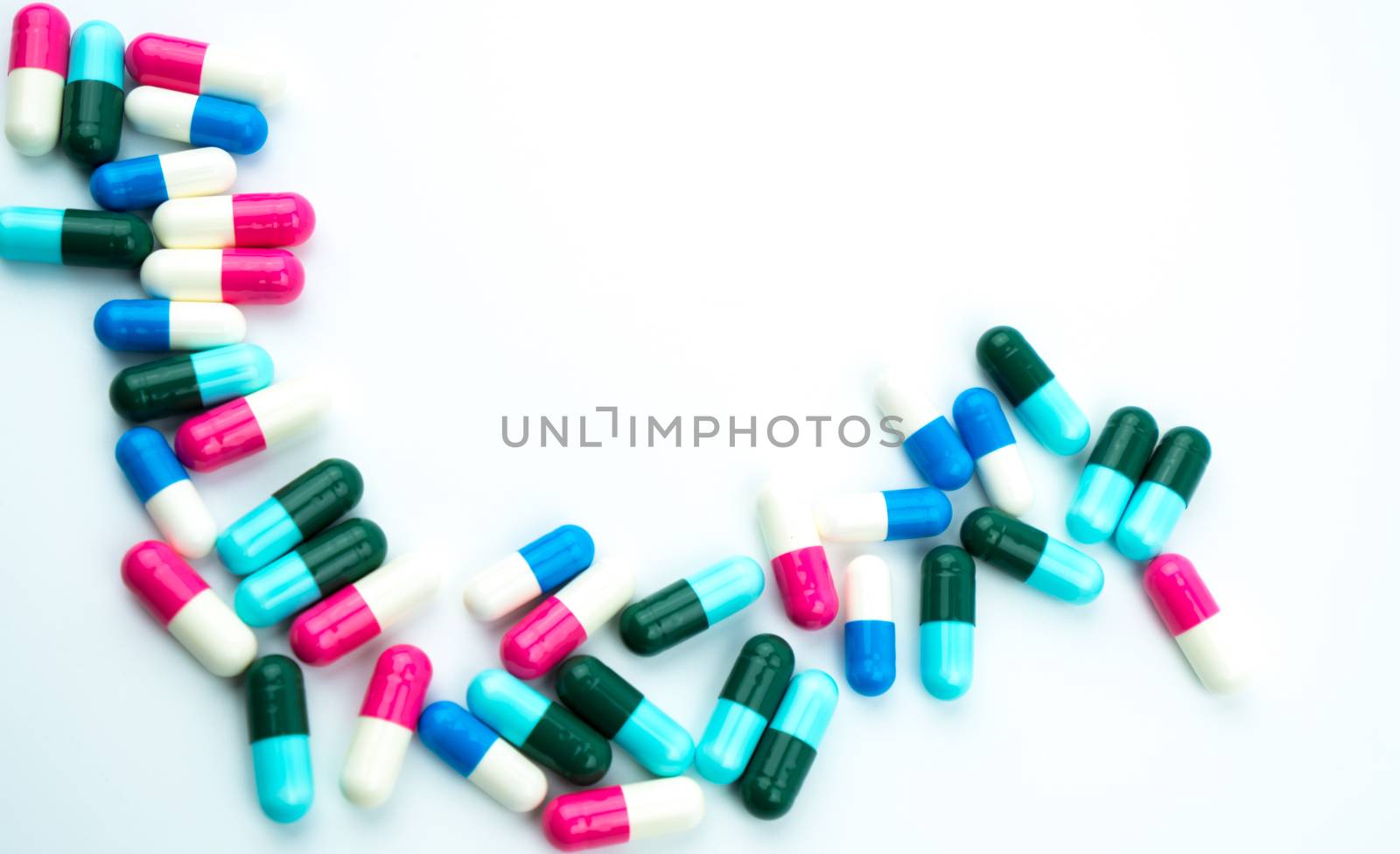 Colorful of antibiotic capsules pills isolated on white background with copy space. Drug resistance, antibiotic drug use with reasonable, health policy and health insurance concept. Pharmaceutical industry. Pharmacy background.