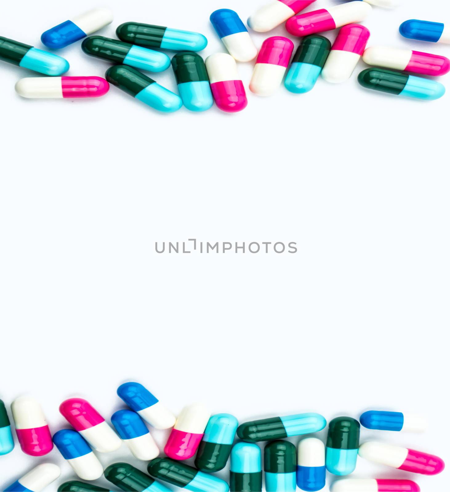 Colorful of antibiotic capsules pills isolated on white background with copy space. Drug resistance, antibiotic drug use with reasonable, health policy and health insurance concept. Pharmaceutical industry. Pharmacy background. by Fahroni