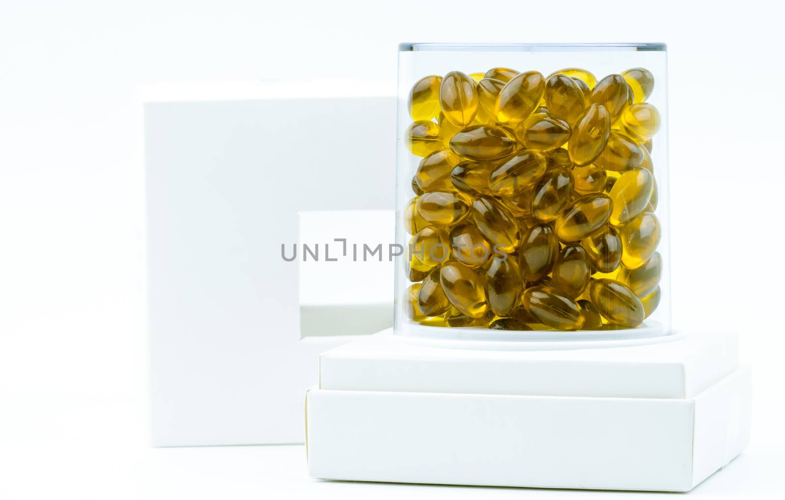 Rice bran oil extract capsule in luxury plastic box packaging isolated on white background