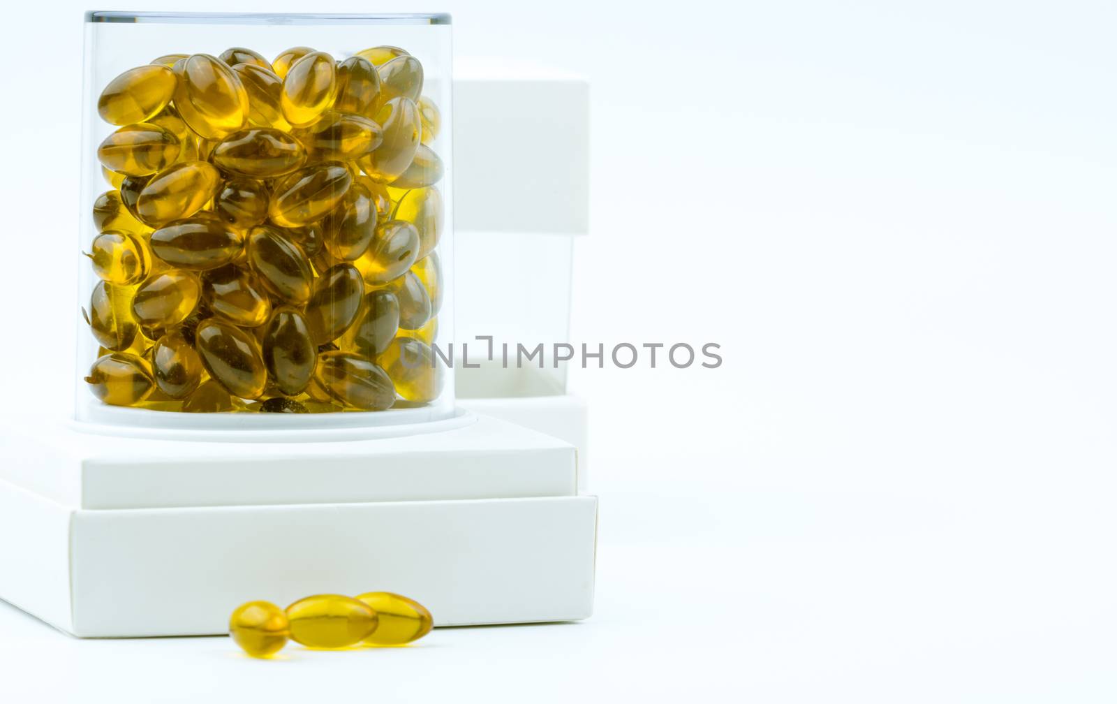 Rice bran oil extract capsule in luxury plastic box packaging on white background