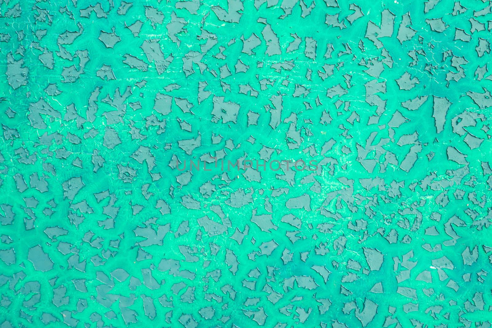Green peeling paint on the metal surface texture background.
