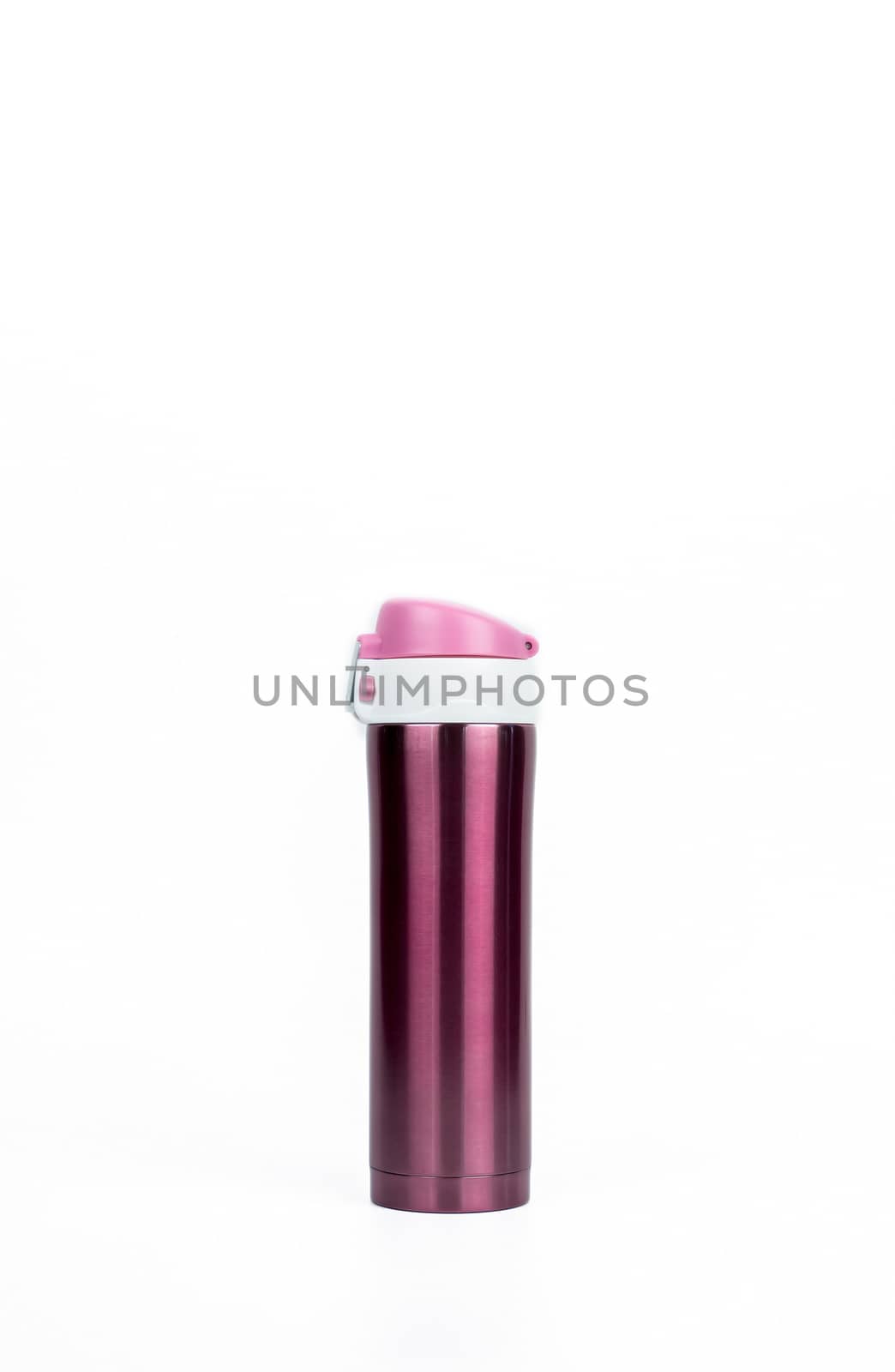 Pink thermos bottle isolated on white background with copy space. Coffee and tea bottle container.
