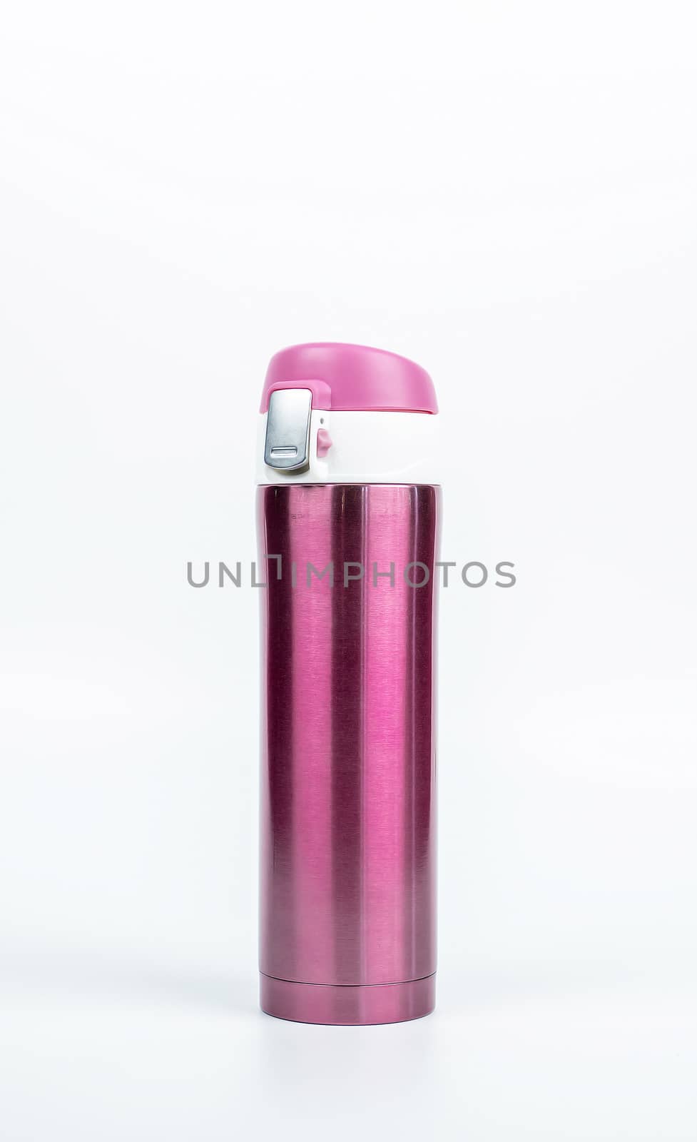 Pink thermos bottle isolated on white background with copy space. Beverage container. Coffee and tea bottle.