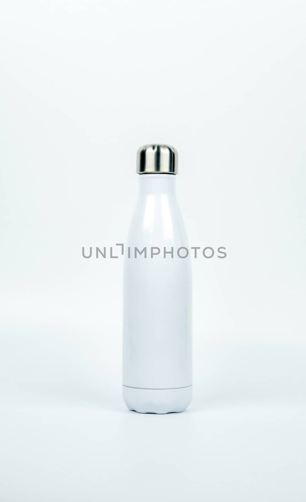 White thermos bottle with sport design on white background with copy space. Beverage container. Coffee and tea bottle. by Fahroni