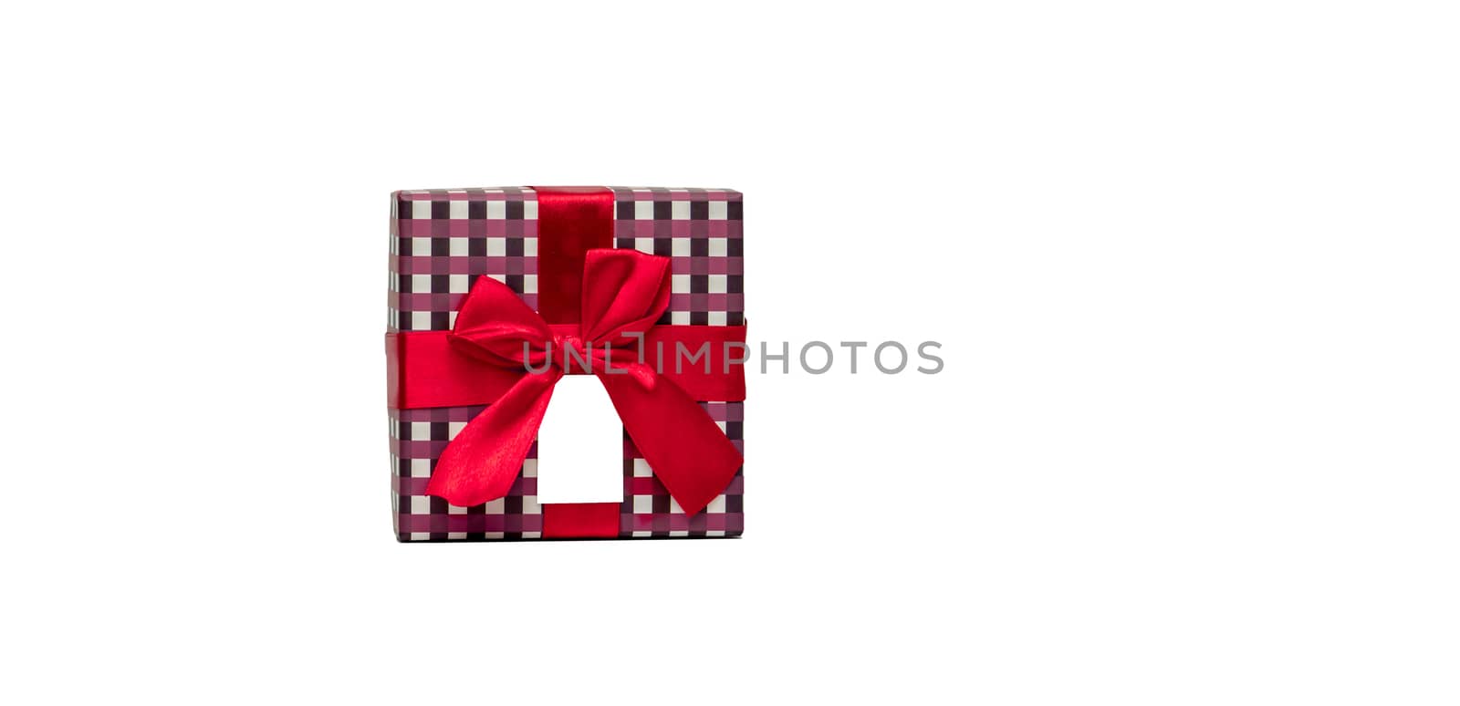 Plaid pattern gift box with red ribbon bow and blank greeting card isolated on white background with copy space, just add your own text. Use for Christmas and new year festival by Fahroni
