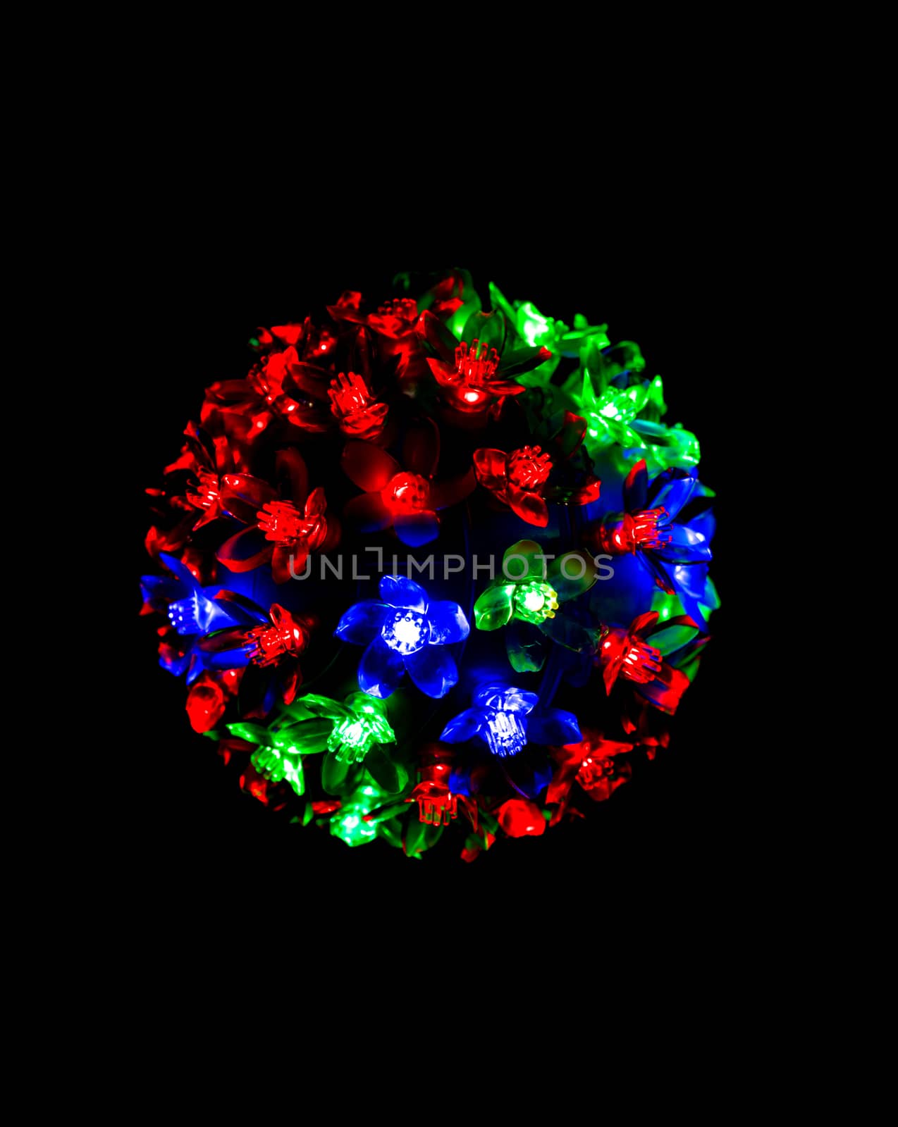 Red, blue and green light on dark background for Christmas concept with copy space